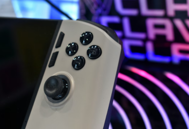 A close-up of a gaming controller with buttons and joystick