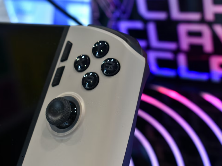 A close-up of a gaming controller with buttons and joystick